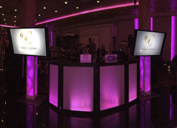 <b>Dual 60” Media Screens</b> Enhance your wedding with our dual TV monitors, perfect for showcasing photos, videos, and live feeds throughout your celebration! This package includes photo and video programming, ensuring a seamless flow of media to capture and display your most memorable moments. We’ll take care of the setup and arrangement so you can focus on enjoying the special moments while your guests experience the magic through stunning visuals!
