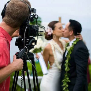 <b>Videography Package (PRO): Getting Ready Shots, Bride and Groom With 2 Shooters + Reception and Ceremony + Up to 8 Hours of Coverage.</b> Capture every priceless moment of your special day with professional wedding videography. From the heartfelt vows to the unforgettable dance floor moments, our videographers ensure no detail is missed, and the professional editing will leave you with a polished, cinematic film to cherish for years to come.